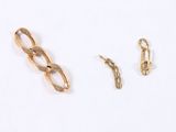 three pieces of gold chain on a white surface