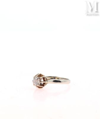 a close up of a diamond ring on a white background