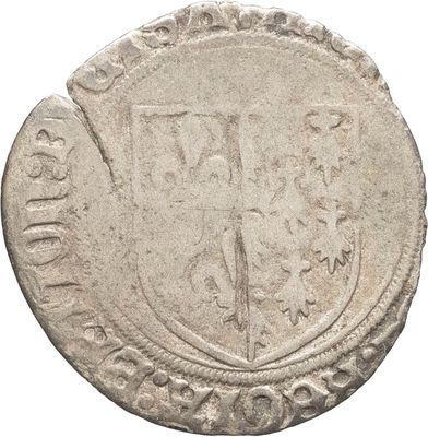 Gros plan sur une pièce de monnaie portant des armoiries