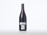 a bottle of wine that is sitting on a table