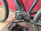 a close up of a bike with a shoe on the ground next to it