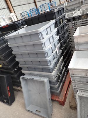 a lot of plastic containers stacked on top of each other