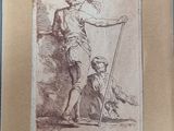 an old picture of a man holding a stick next to a dog