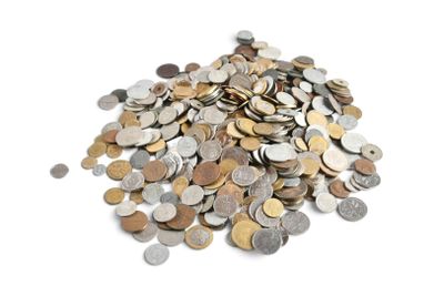 a pile of coins on a white surface