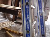 two ladders that are sitting in the middle of a room