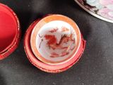 a red box with a red dragon on it and a red box with a red dragon on it