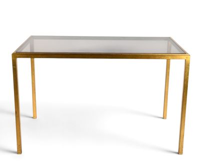 an image of a glass table with gold legs and a glass top