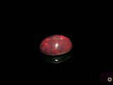 an image of a red and black object in the dark