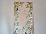 a picture of a wall hanging on the wall above a table