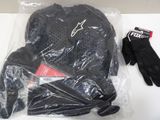 a glove, gloves, and a glove sitting on a table