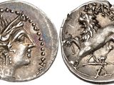 a silver coin with an image of a horse on it