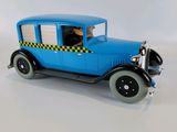 a toy car that is sitting on a white surface