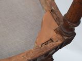 a wooden chair with a seat that has been stripped off