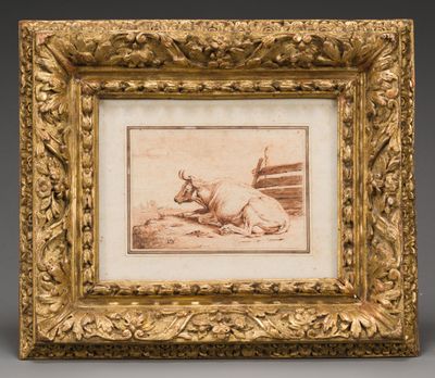 an old picture of a bull laying on the ground in a gold frame