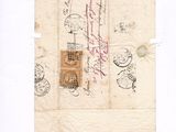 un vieux bout de papier sur lequel figurent des inscriptions et un cachet