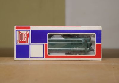 a toy train in a box on a table