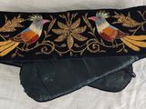 black velvet clutch with embroidered bird design