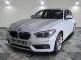 a picture of a white bmw car on a checkered floor
