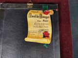 a picture of a certificate with a red rose on it