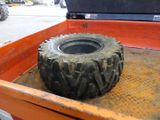 a truck with a tire in the back of it