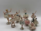 six figurines en porcelaine représentant des ballerines en robe et en tutu