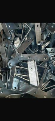 a large pile of metal parts sitting on top of a table