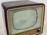 an old fashioned television sitting on top of a table