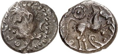 a silver coin with an image of a man on it
