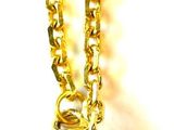 gold plated necklace with a gold box charm hanging from it ' s chain