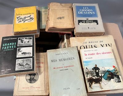 several books are stacked on top of each other on a table
