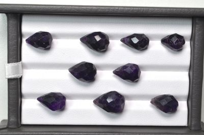 several amethorate gems are displayed in a display case
