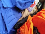 a pile of clothes that is sitting in a box
