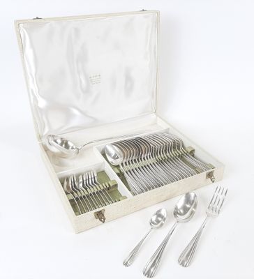 a box with silverware in it on a white surface