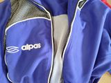 a blue jacket that is sitting on top of a box