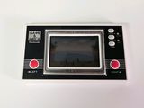 a small game console sitting on top of a white table