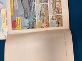 an open book with a comic strip on it