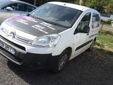 a white van parked in a parking lot next to other cars