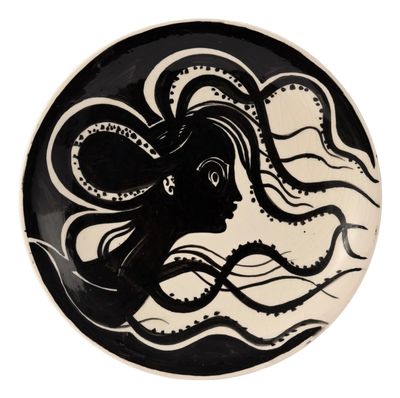 a black and white plate with an octopus on it