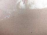 a close up of a person ' s back with a lot of dirt on it