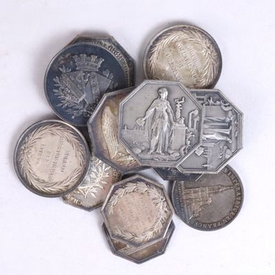 a lot of coins that are sitting on a table