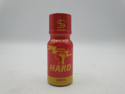 une photo d'une bouteille d'Hard AML posée sur une table