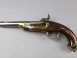 an old gun that is on display on a table