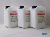 three gallons of liquid sitting next to each other on a white surface