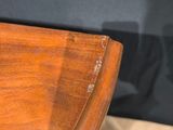 a small wooden table with a drawer underneath it