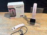 a smart phone that is sitting on a table next to a box