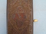 an old book with a picture of a woman on it
