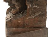 statue of a man and a woman sitting on a book