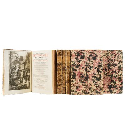 an old book opened to show a picture of a man and a woman