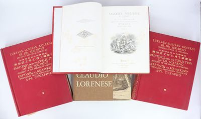 trois livres rouges superposés sur une surface blanche