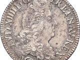 a silver coin with the head of a woman on it